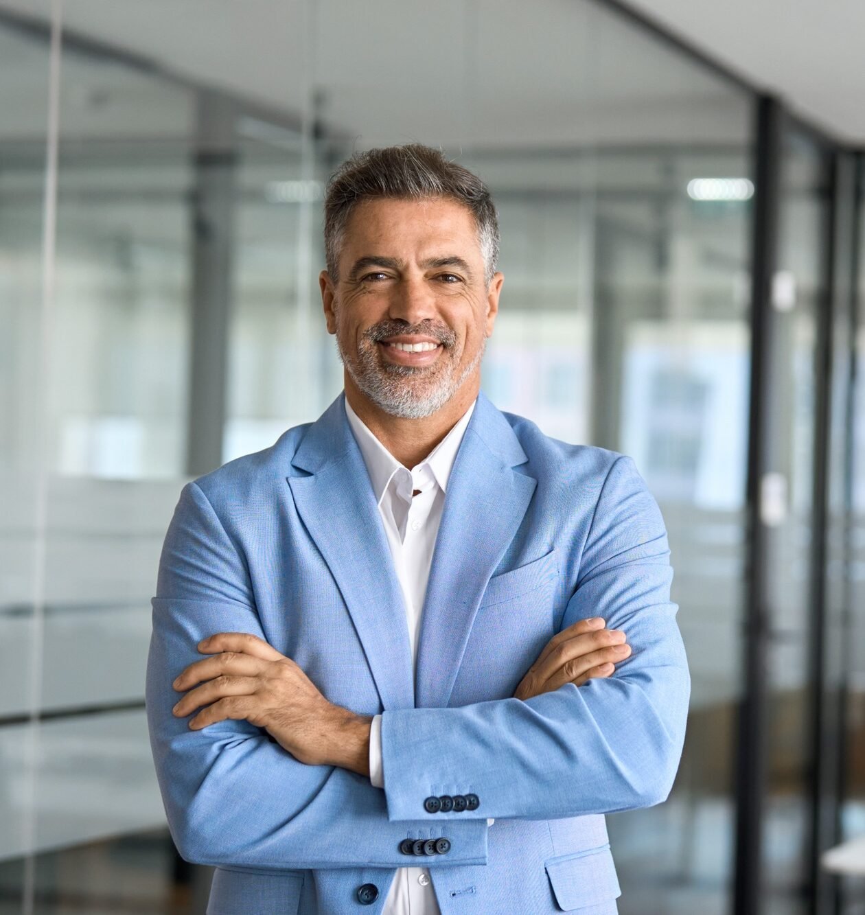 Portrait of confident happy senior business man ceo leader standing in office.